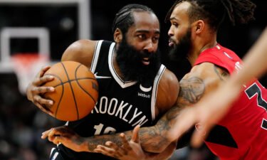 Brooklyn's James Harden drives to the net as Toronto's Gary Trent Jr. defends him.