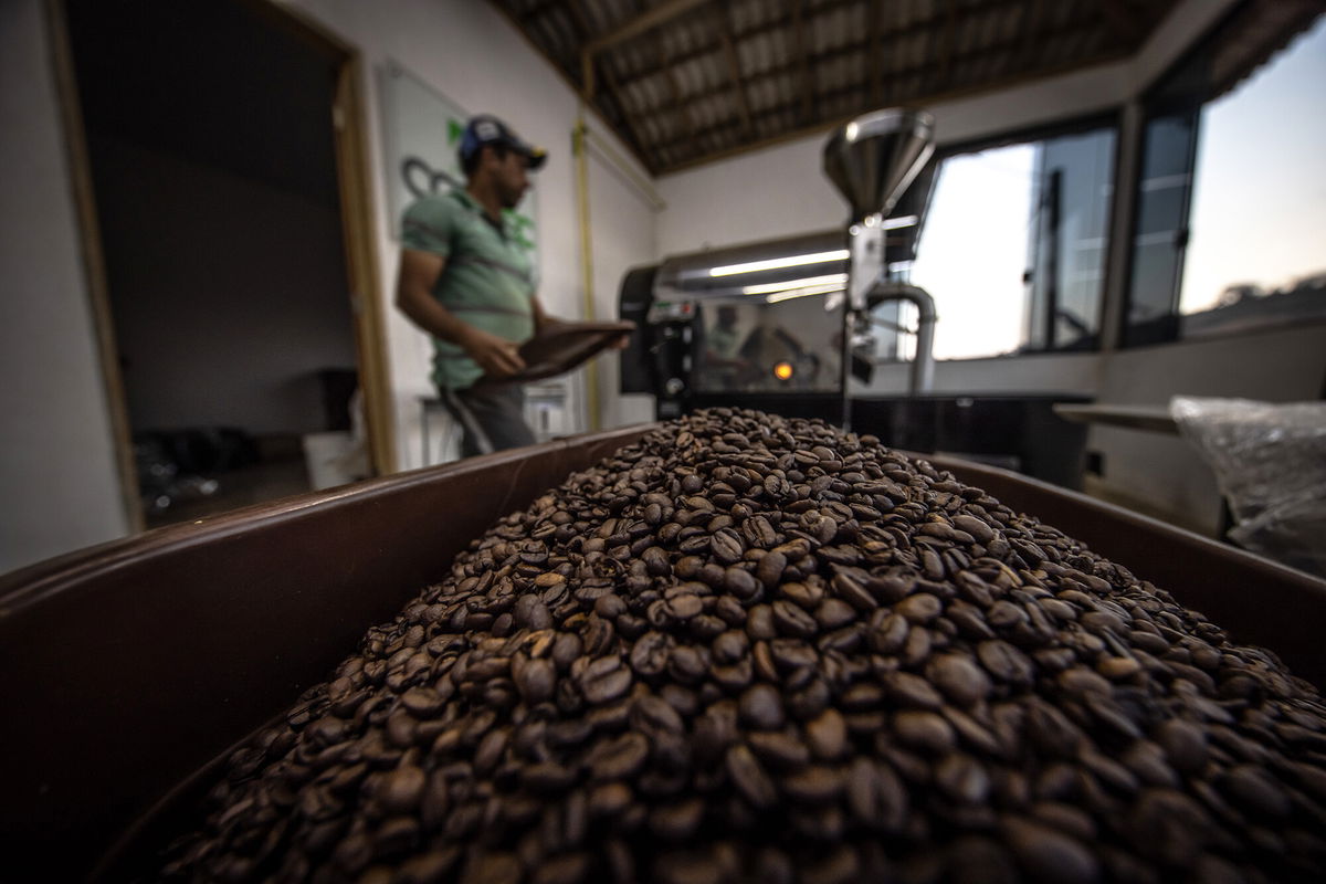 <i>Jonne Roriz/Bloomberg/Getty Images</i><br/>A worker roasts coffee beans at a facility in Caconde