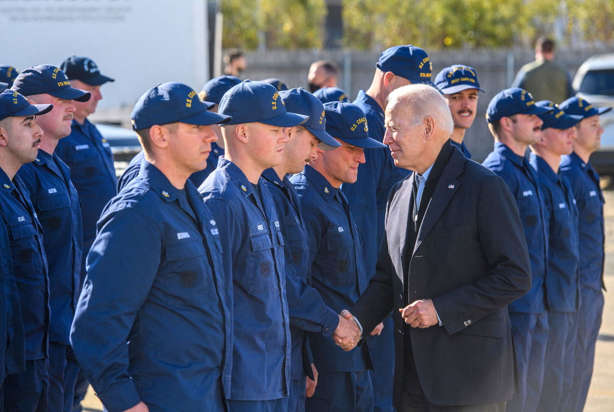 <i>MANDEL NGAN/AFP via Getty Images</i><br/>US President Joe Biden greets members of the Coast Guard at US Coast Guard Station Brant Point in Nantucket