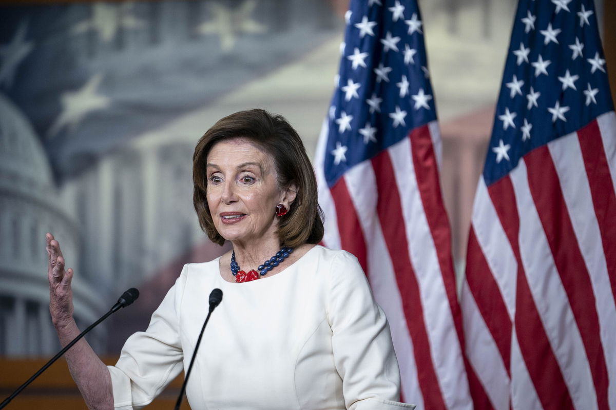 <i>Sarah Silbiger/Getty Images</i><br/>House Speaker Nancy Pelosi reaffirmed House Democrats plan to pass President Joe Biden's roughly $1.9 trillion economic and climate bill next week. Pelosi is shown here at the U.S. Capitol building on November 4