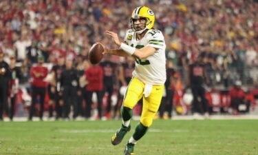 Aaron Rodgers looks to pass against the Arizona Cardinals at State Farm Stadium on October 28.