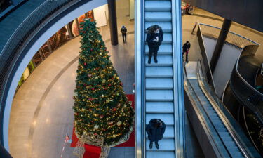 Customers visit a Christmas-decorated shopping center in Leipzig