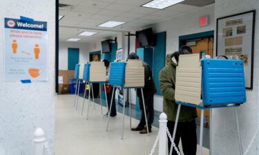 Voters fill out their ballots at an early voting center at the Mount Vernon Governmental Center on October 31