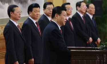 Zhang Gaoli (L) stands with the other six members of the Chinese Communist Party inside the Great Hall of the People in Beijing on November 15