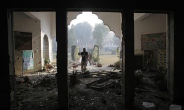 The Pakistani government and the armed militant group the Pakistani Taliban have agreed to a one-month ceasefire. This file photo shows a Pakistan army soldier inspecting the Army Public School that was attacked by militants