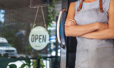 The woman is a waitress in an apron