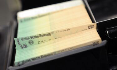 In this photo illustration U.S. Treasury checks are piled at the U.S. Treasury printing facility July 18