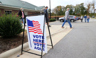 The Supreme Court said Wednesday that it will hear a case brought by Republican legislators in North Carolina who are seeking to defend the state's strict voter ID law. Voters arrive and depart a polling place on October 31