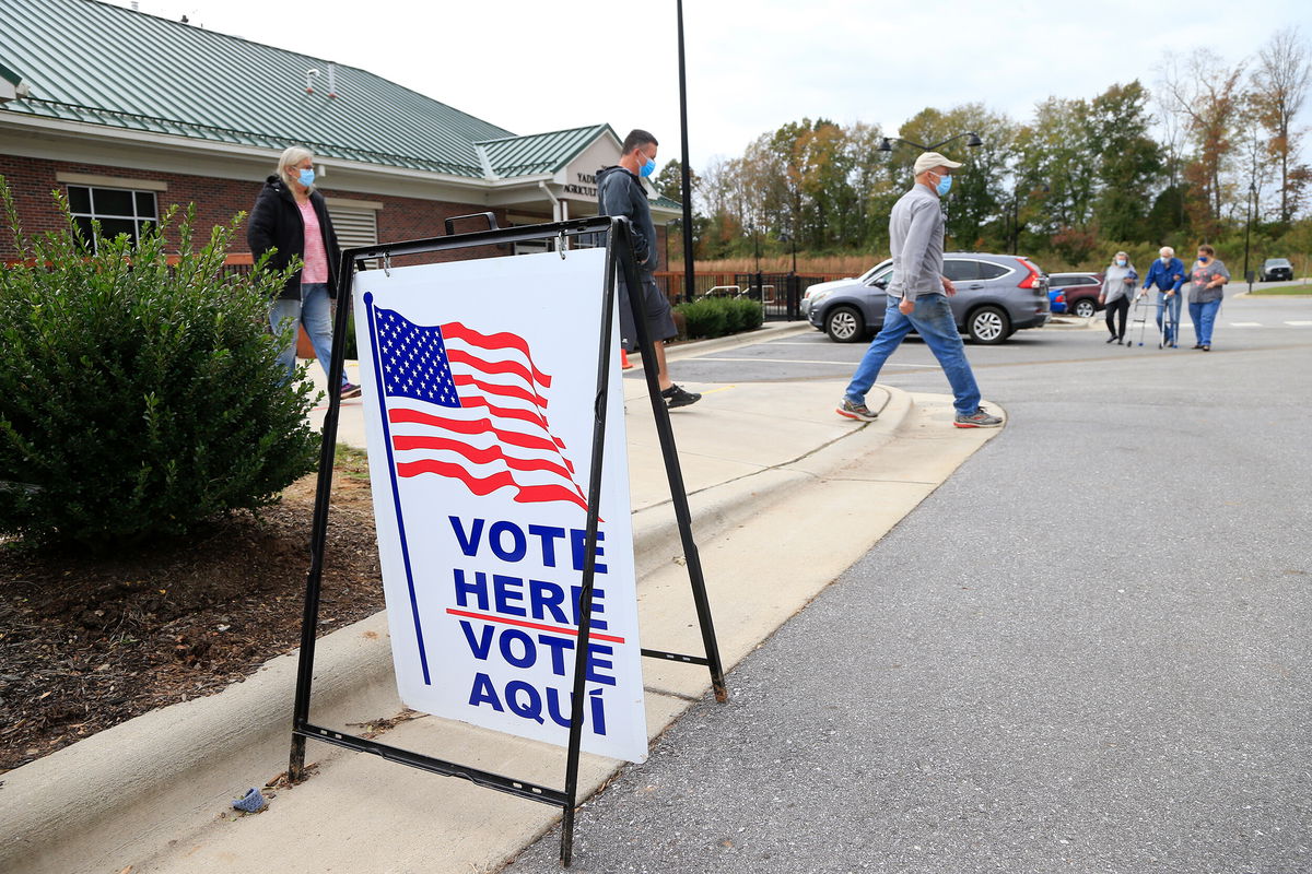 <i>Brian Blanco/Getty Images/.FILE</i><br/>The Supreme Court said Wednesday that it will hear a case brought by Republican legislators in North Carolina who are seeking to defend the state's strict voter ID law. Voters arrive and depart a polling place on October 31