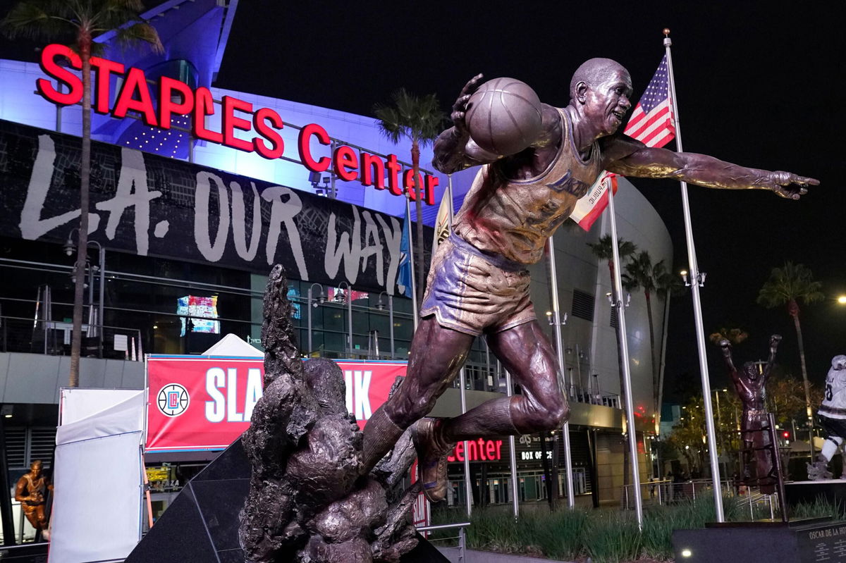 <i>Mark J. Terrill/AP</i><br/>The statue of former Los Angeles Lakers Magic Johnson is seen in front of Staples Center following an NBA basketball game between the Los Angeles Clippers and the San Antonio Spurs Tuesday