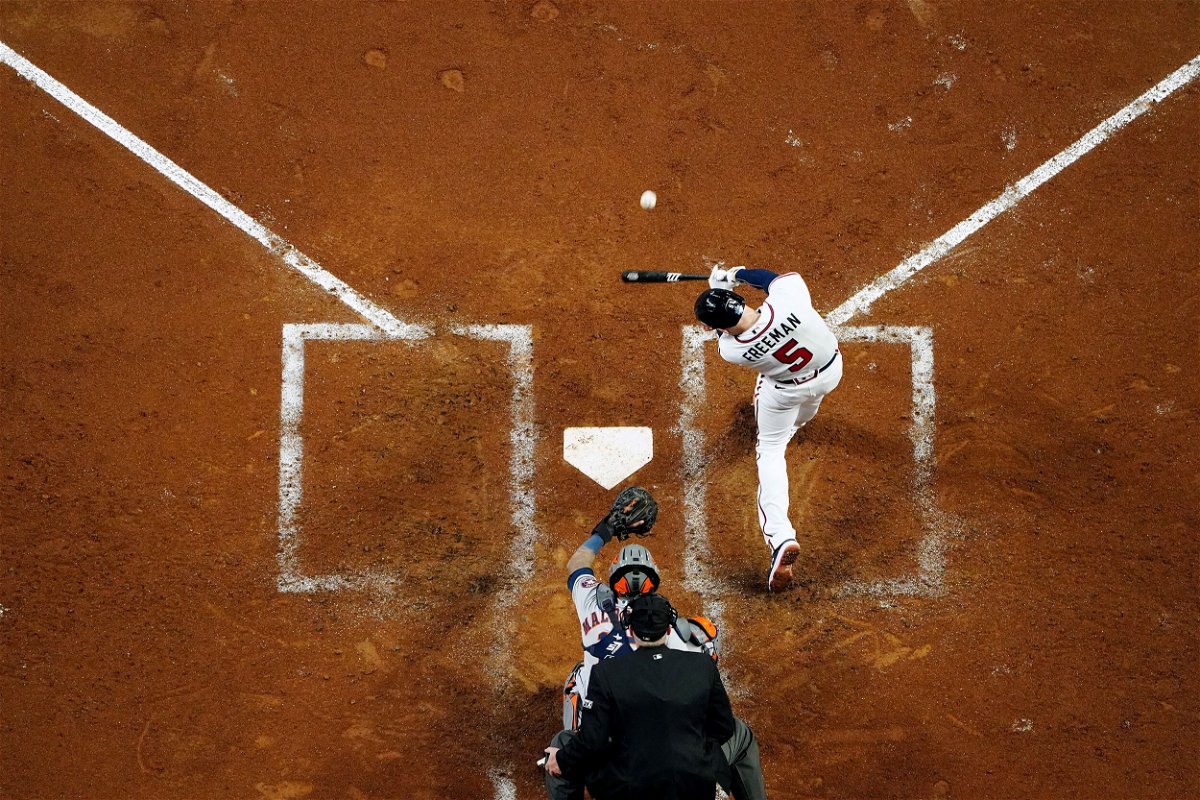 <i>Daniel Shirey/MLB Photos/Getty Images</i><br/>Freddie Freeman of the Braves hits a solo homer in the third inning during Game 5.
