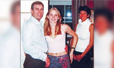 A photograph which appears to show Prince Andrew with Jeffrey Epstein's accuser Virgina Guiffre