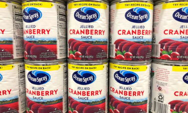 Grocery store shelf with cans of Ocean Spray brand Jellied Cranberry Sauce in Alameda