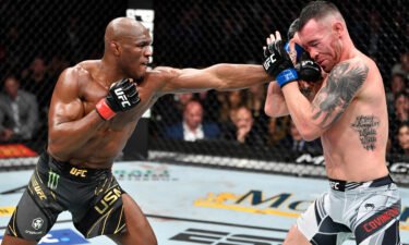 Kamaru Usman of Nigeria punches Colby Covington of the US in their UFC welterweight championship fight during the UFC 268 event at Madison Square Garden.
