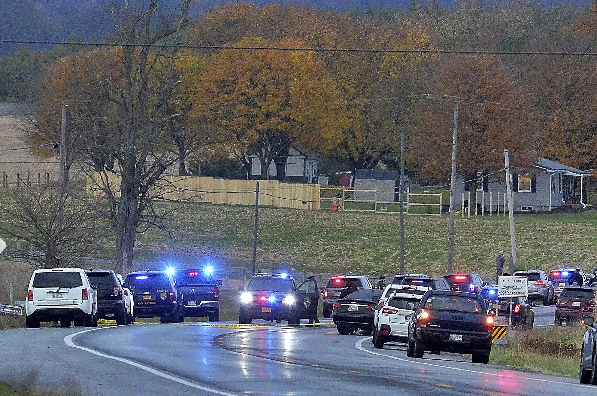 <i>Colleen McGrath/Herald-Mail/AP</i><br/>Authorities work at the scene where four people were found dead in a vehicle -- in what police say was a murder-suicide incident -- on Thursday outside Ringgold