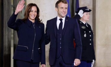 France's President Emmanuel Macron (R) welcomes US Vice President Kamala Harris prior to a meeting at the Elysee Palace in Paris on November 10.