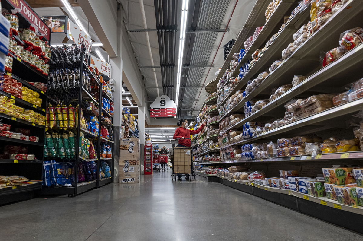 <i>David Paul Morris/Bloomberg/Getty Images</i><br/>A customer shops for groceries at a store in San Francisco