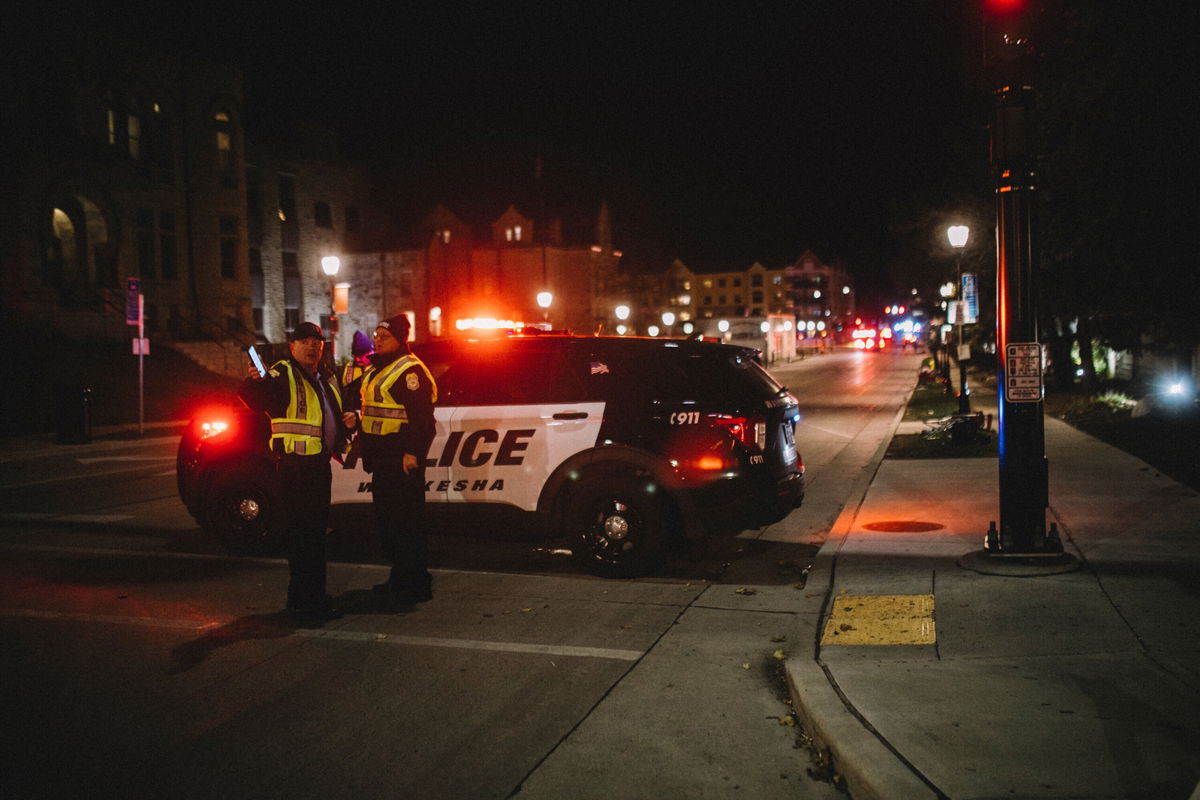 <i>Jim Vondruska/Getty Images</i><br/>Police and emergency personnel work on a crime scene on November 21