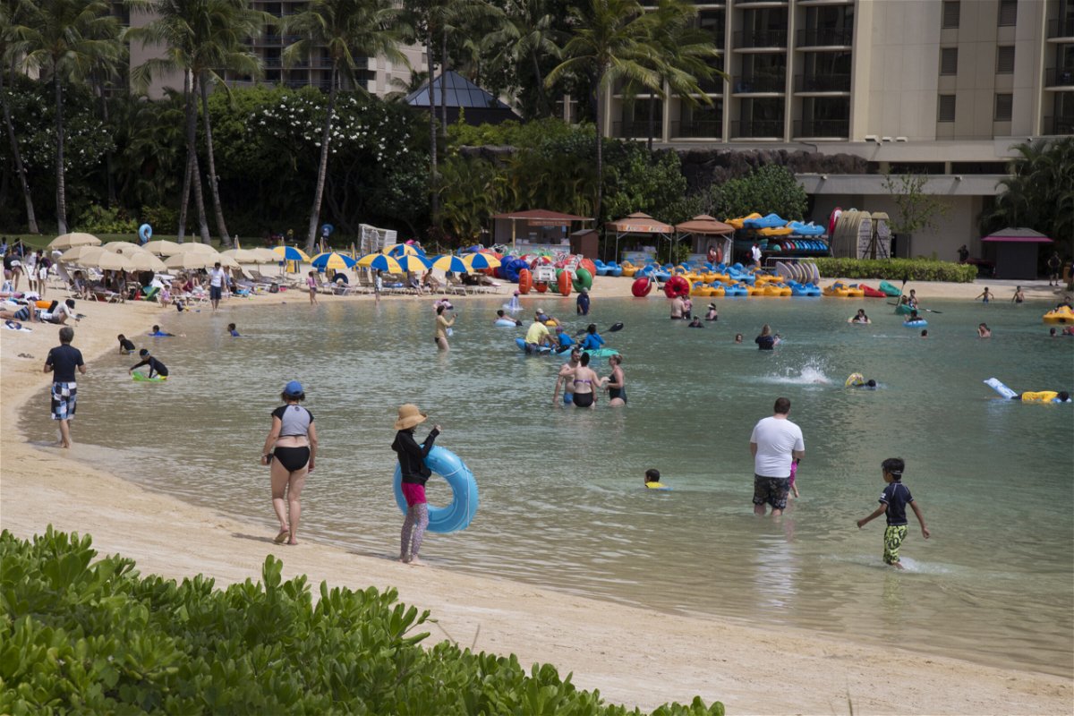 <i>Kat Wade/Getty Images</i><br/>Experts weigh in on where to go for the holidays and risks. Hawaii is once again welcoming tourists.