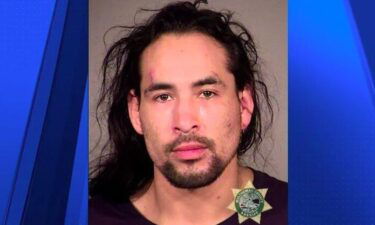 Portland police say Brian D. Denault is in custody after using a van to ram into police vehicles before running away from officers on Wednesday.