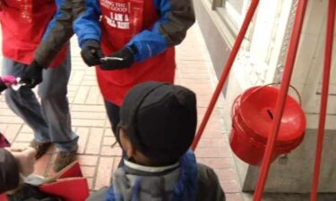 A man was arrested after assaulting a Salvation Army bell ringer and stealing a red collection kettle.