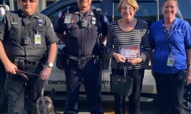 Mrs. Ann (center right) purchased five planes tickets for the family that was stranded on the highway.