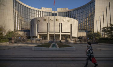 China cuts key interest rate for the first time in 20 months. Pictured is the People's Bank of China (PBOC) in Beijing