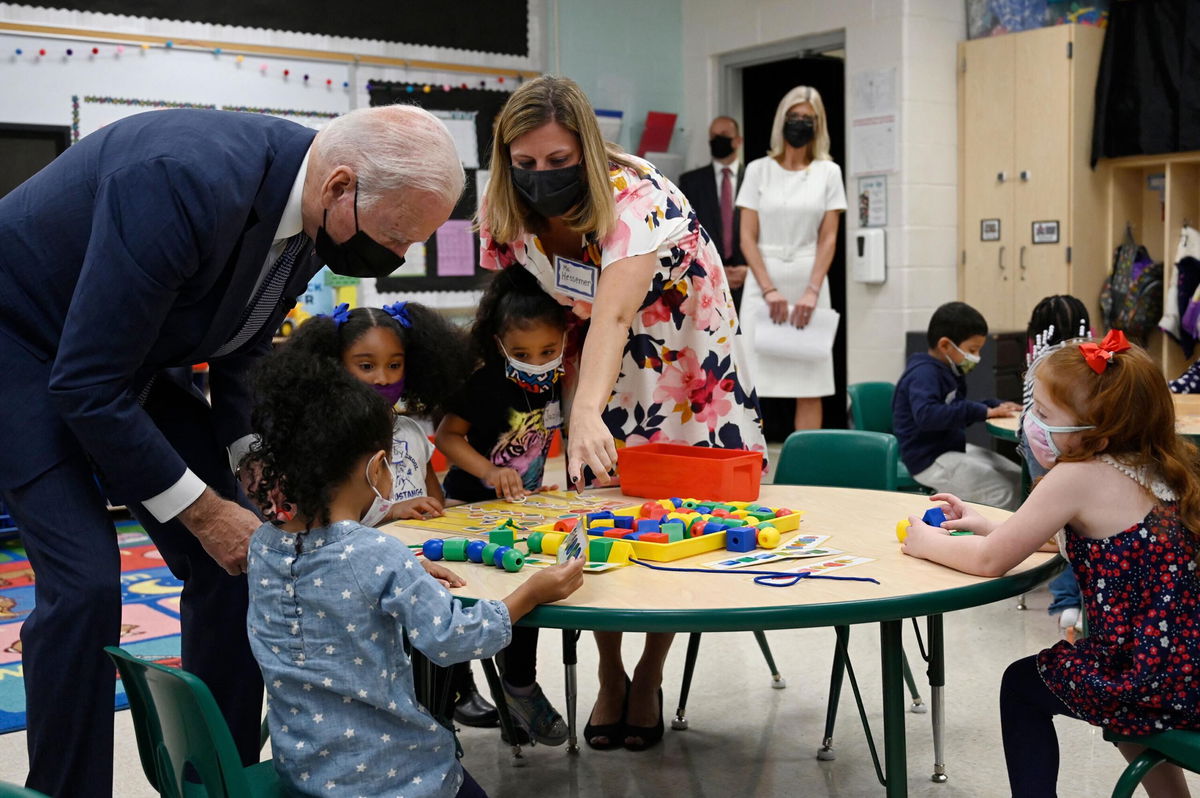 <i>Andrew Caballero-Reynolds/AFP/Getty Images</i><br/>President Joe Biden talks to students during a visit to a Pre-K classroom at East End Elementary School in North Plainfield