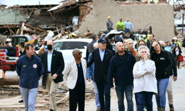 President Joe Biden (C) tours Mayfield