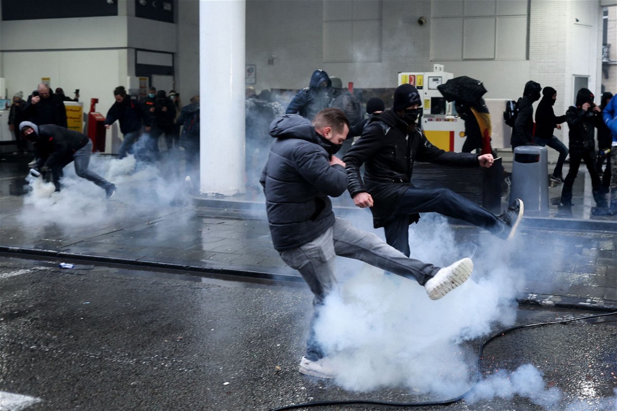 <i>Kenzo Tribouillard/AFP/Getty Images</i><br/>Protesters confront riot police during a demonstration against Covid-19 measures in Brussels