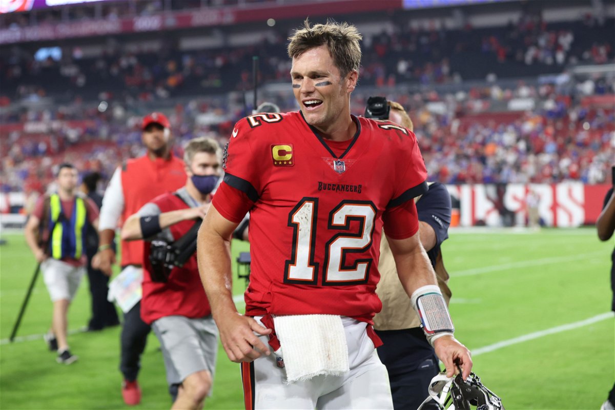 <i>Mark LoMoglio/AP</i><br/>Tom Brady smiles as he leaves the field after the Buccaneers dramatically beat the Buffalo Bills in overtime.