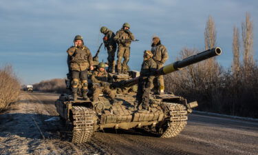 Ukrainian soldiers who left Debaltseve yesterday prepare to return to support the further withdrawal of troops on February 19