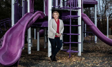 Nicole Hockley poses for a portrait at a playground dedicated to her son Dylan