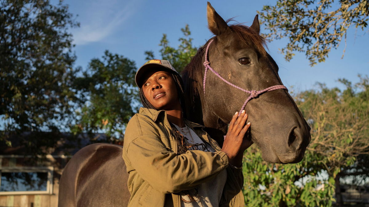 <i>Nitashia Johnson for CNN</i><br/>Deydra Steans shown with her horse Cairo as she ends the day at her farm in Luling