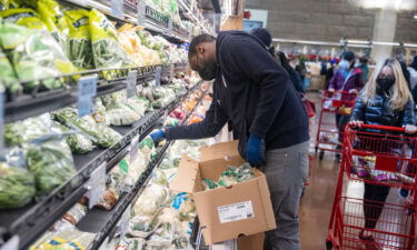 An employee restocks shelves at the Trader Joe's Upper East Side Bridgemarket grocery store in New York