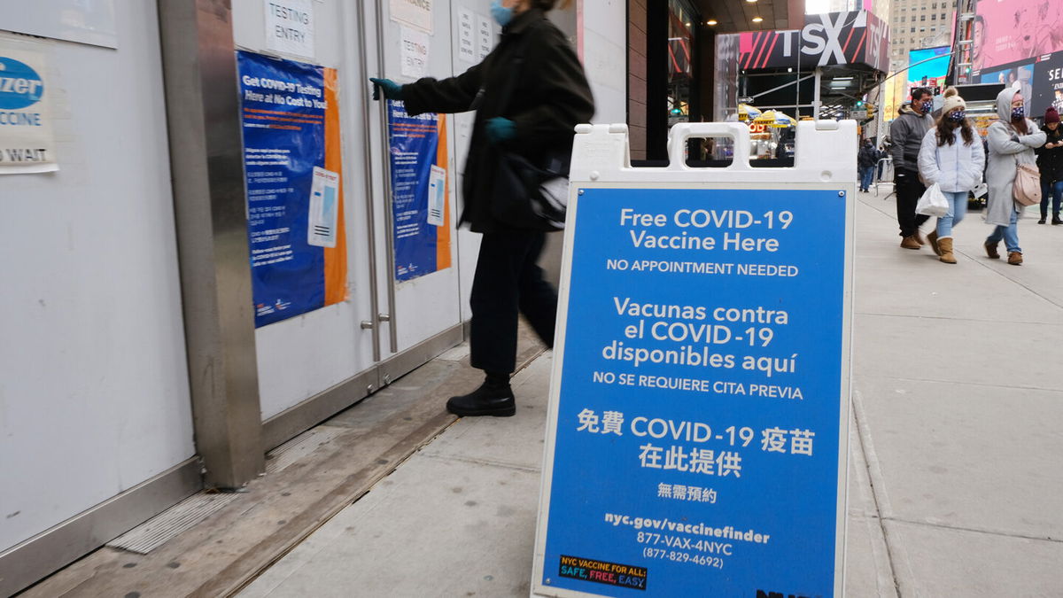 <i>Spencer Platt/Getty Images</i><br/>A COVID-19 vaccination pop-up site stands in Times Square on December 9 in New York City.