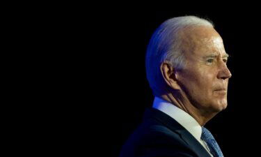 President Joe Biden speaks during a holiday reception for the Democratic National Committee in Washington