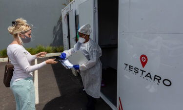 A resident registers her details at a Covid-19 mobile testing site in the Milnerton district of Cape Town