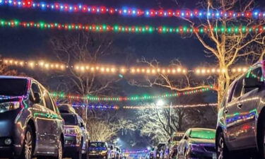 Neighbors connect their holiday lights on Dunkirk Rd. in Towson
