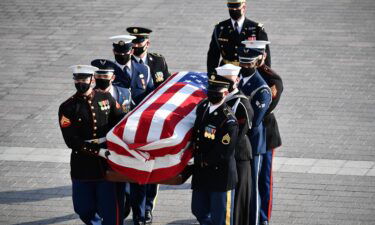 The casket of former Senator Bob Dole arrives at the U.S. Capitol where he will lie in state on December 9 in Washington