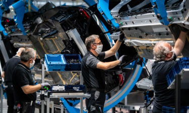 Workers assemble the new S-Class Mercedes-Benz passenger car at the new "Factory 56" assembly line at the Mercedes-Benz manufacturing plant in 2020 in Sindelfingen