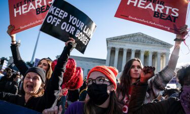 The Supreme Court lets Texas abortion law continue but says providers can sue.