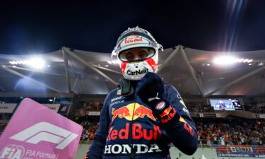 Pole position qualifier Max Verstappen of Netherlands and Red Bull Racing celebrates in parc ferme during qualifying ahead of the F1 Grand Prix of Abu Dhabi at Yas Marina Circuit on December 11 in Abu Dhabi.