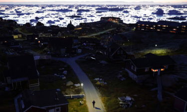 Ice and icebergs float in the distance in Disko Bay in September 2021 in Ilulissat