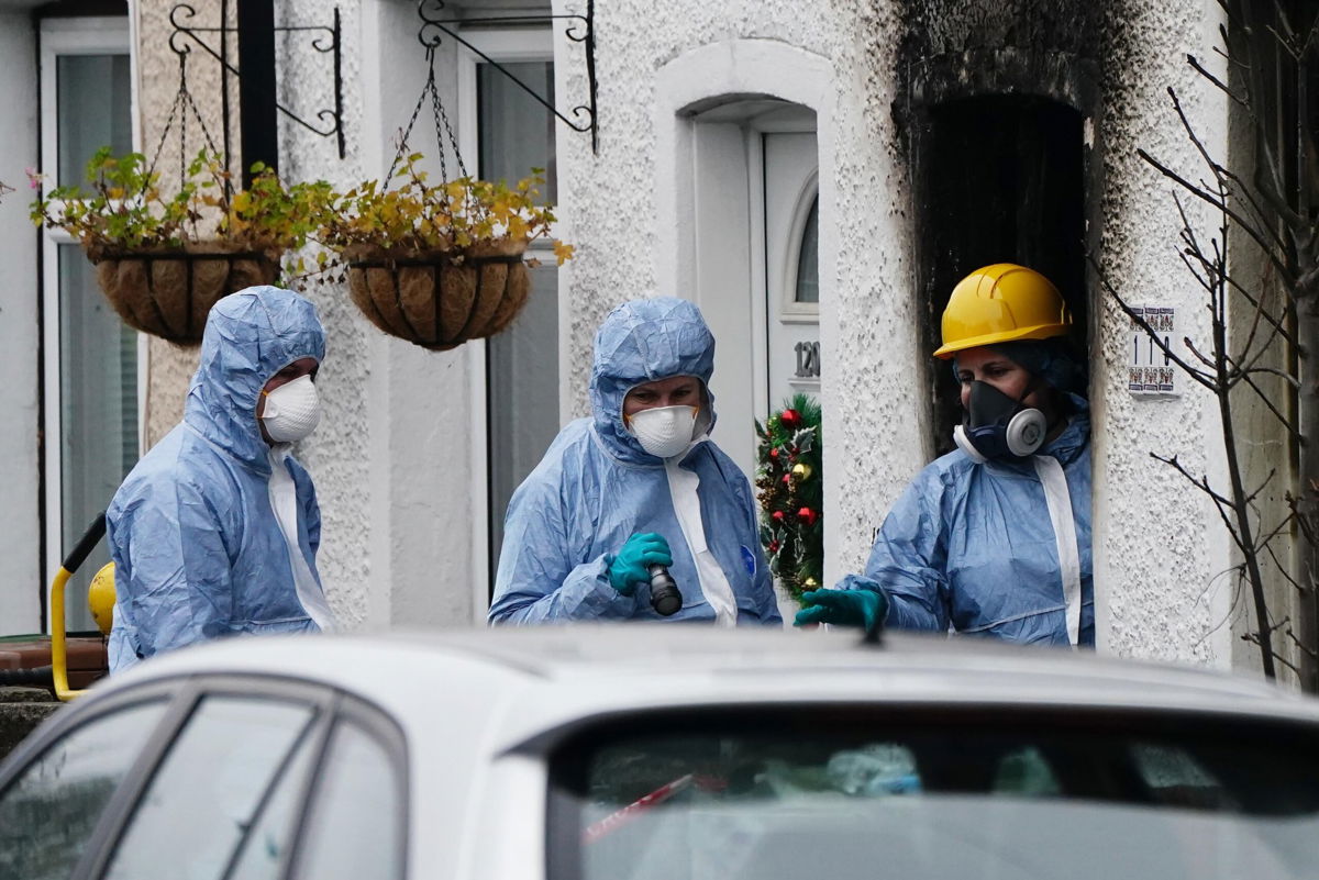 <i>Aaron Chown/PA/Getty Images</i><br/>Forensic investigators at the scene in Collingwood Road