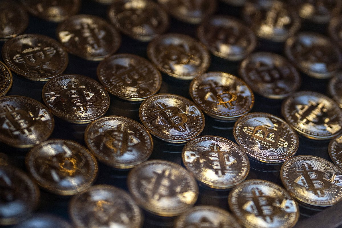 <i>Moe Zoyari/Bloomberg/Getty Images</i><br/>Bitcoin and other cryptos may become a little less volatile in 2022. Bitcoin and Ether hit all-time highs in a cryptocurrency rally that some analysts attributed partly to the search for a hedge against inflation.