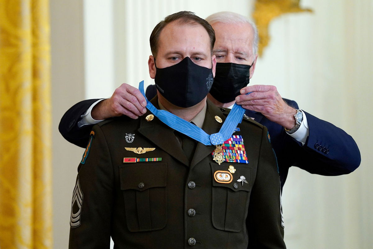 <i>Evan Vucci/AP</i><br/>President Joe Biden presents the Medal of Honor to Army Master Sgt. Earl Plumlee for his actions in Afghanistan on Aug. 28