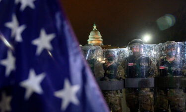 Members of the DC National Guard are deployed outside of the US Capitol in Washington DC on January 6