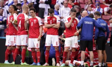 Denmark's players react as paramedics attend to Christian Eriksen after he collapsed on the pitch in June.