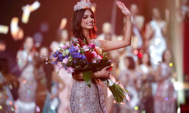 India's Harnaaz Sandhu waves after being crowned Miss Universe 2021 during the 70th Miss Universe pageant